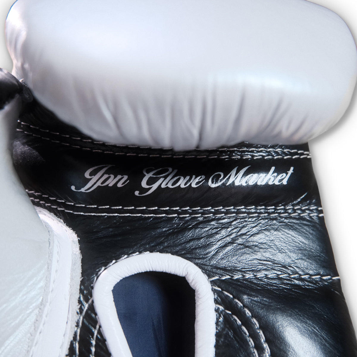 JPN Pro Series 16oz gloves, silver and black, angled view