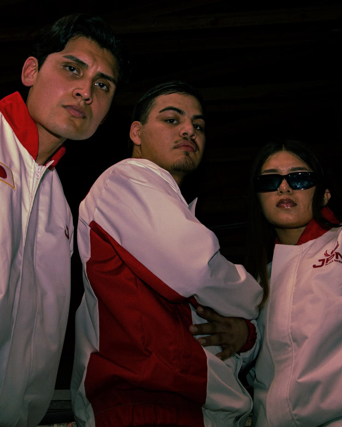 Three friends in the JPN Team Japan tracksuit jackets